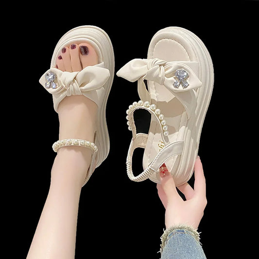 Hot selling sandals for women in summer 2024, new thick soled fairy style pearl beach shoes, soft soled fashion Roman shoes